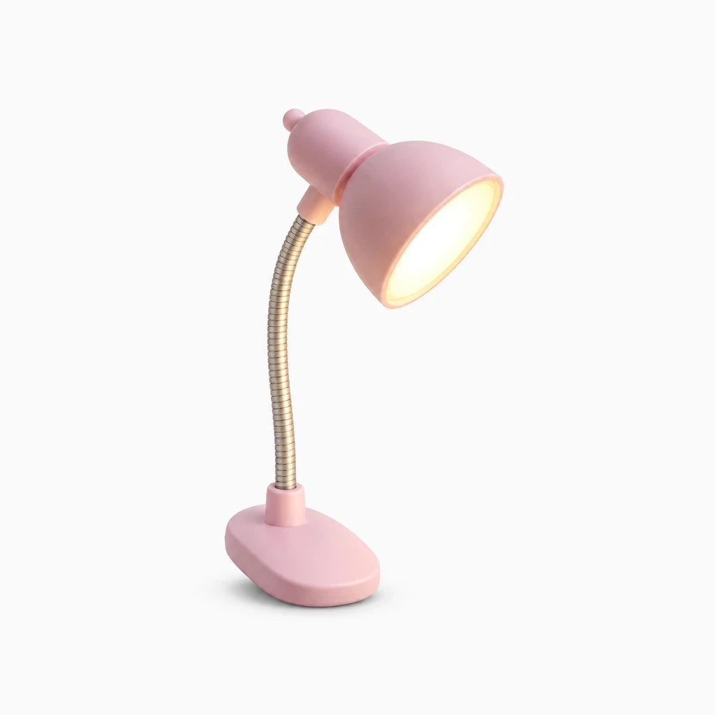 Lampes sur pince compactes en blanc et rose, posées sur une table de nuit minimaliste