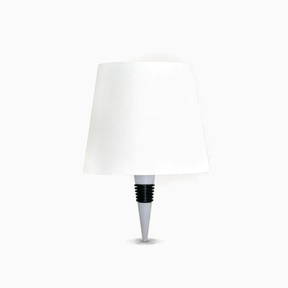 Lampe bouteille sans fil avec socle compact éclairant une bouteille de verre