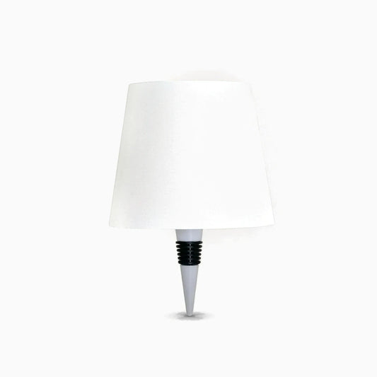 Lampe bouteille sans fil avec socle compact éclairant une bouteille de verre