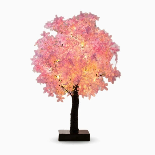 Lampe de chevet rose en forme de fleur avec diffusion de lumière chaude sur table de nuit