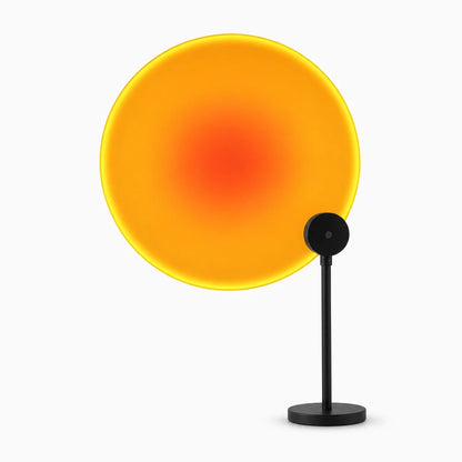 Lampe soleil projetant un halo chaud sur mur et plafond avec sept options de couleur
