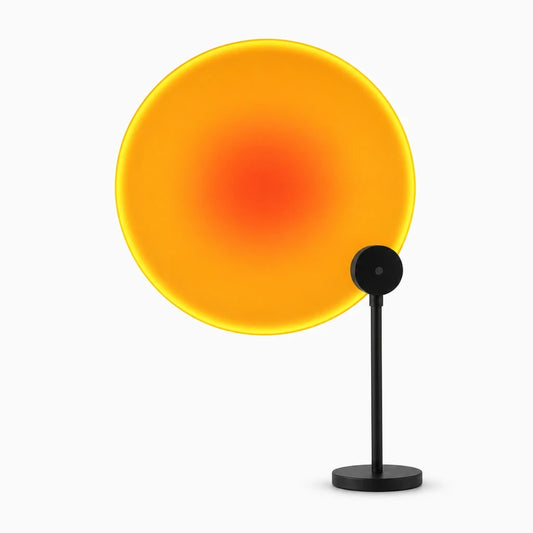 Lampe soleil projetant un halo chaud sur mur et plafond avec sept options de couleur