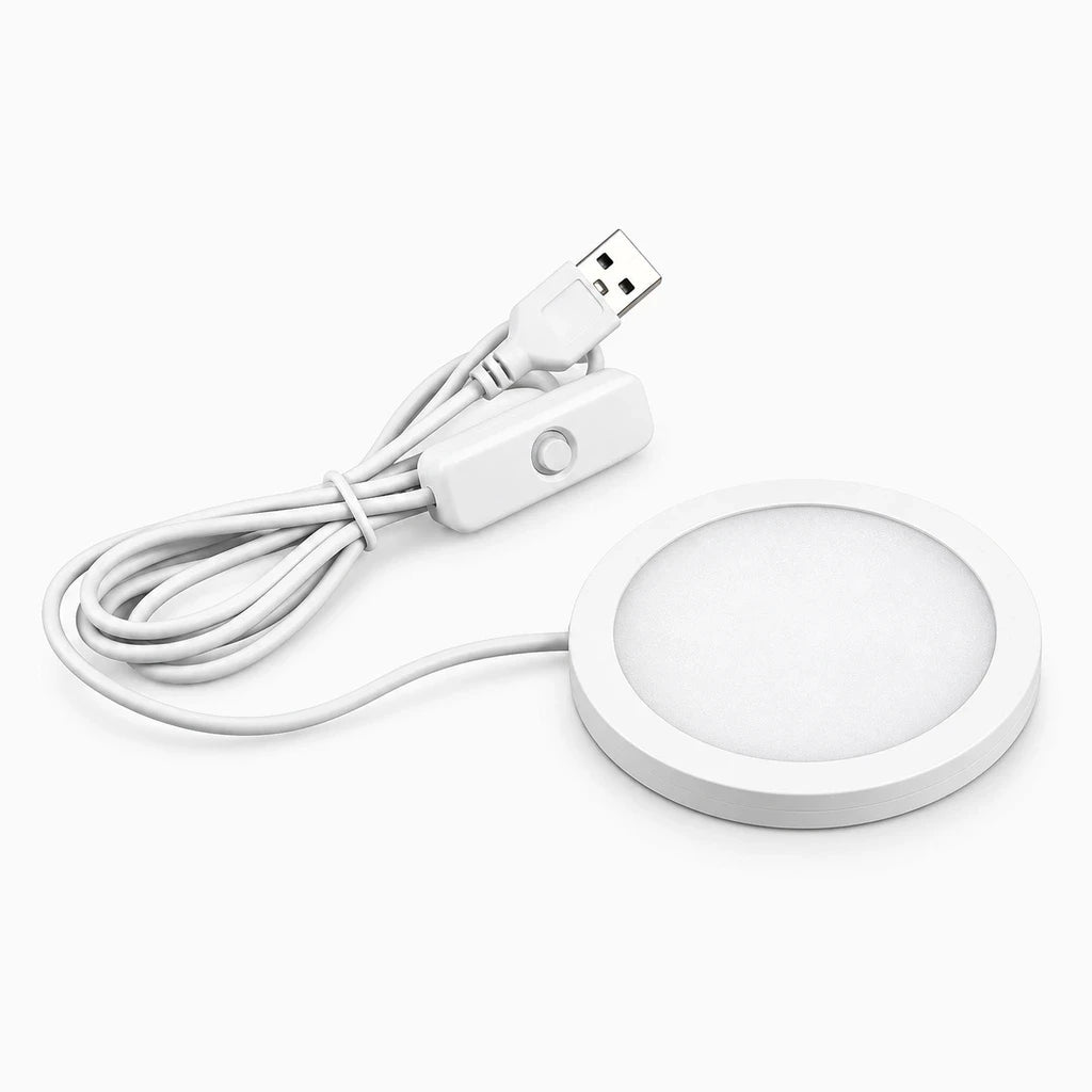 Petite veilleuse ronde blanche avec LED, alimentation USB et bouton de contrôle pour trois teintes de lumière