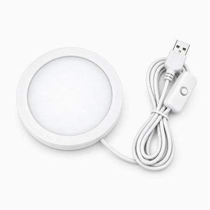 Petit luminaire rond blanc brillant, design minimaliste adapté à tout intérieur, équipé de LED à variation de couleur